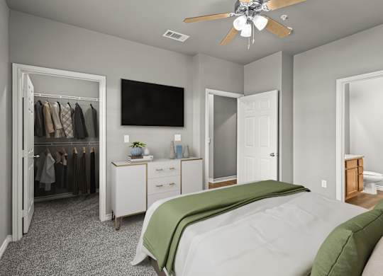 A bedroom with a bed, dresser, and a television.