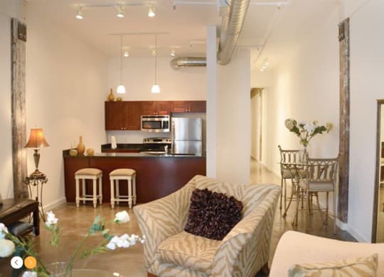 a living room with a couch a chair and a table
