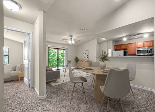 A modern kitchen with a dining table and chairs.