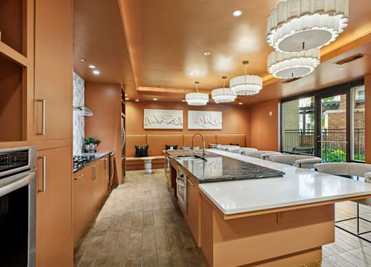 A modern kitchen with a long counter and a large island.