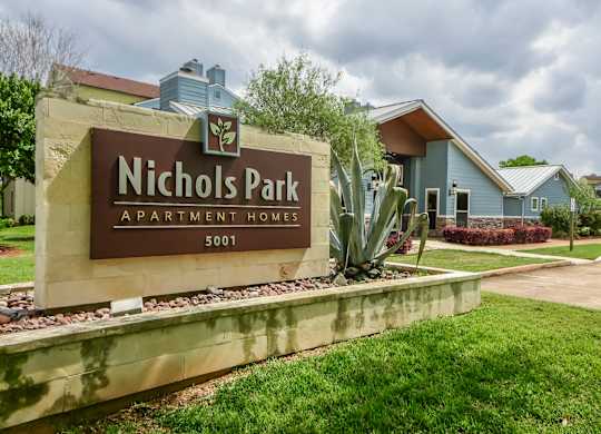 Nichols Park Apartment Homes sign in front of a building.