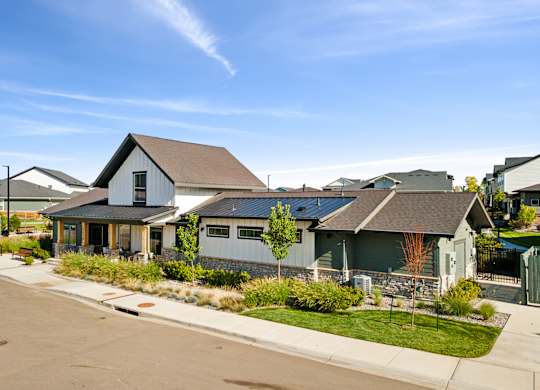 A row of houses with a clear blue sky above them.