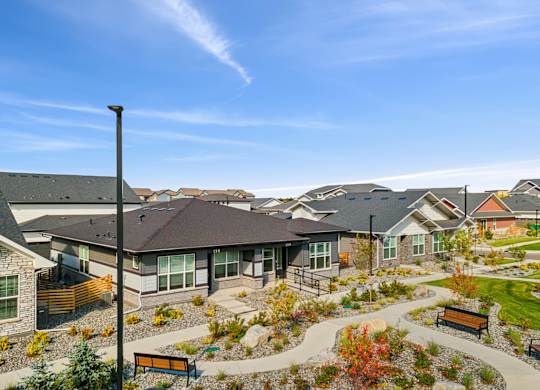 A residential area with houses and a clear sky.