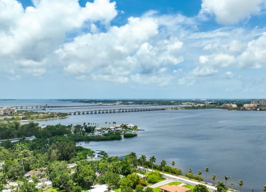 an aerial view of a body of water with a city in the background