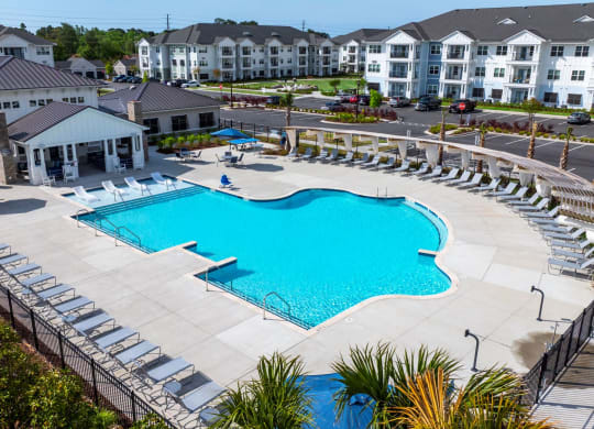 an aerial view of a swimming pool at an apartment complex