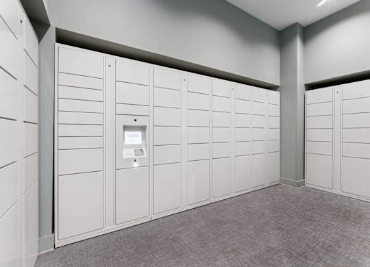 A row of white lockers in a room.