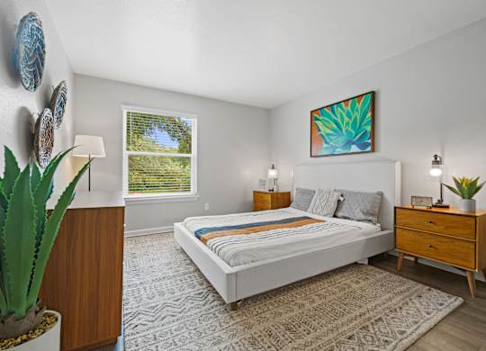 a bedroom with a bed and a dresser