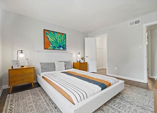 a bedroom with a bed and two night stands