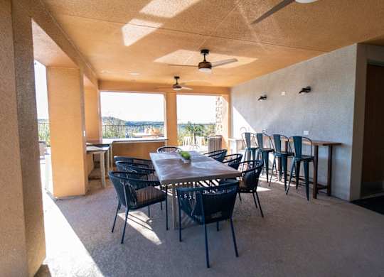 A patio with a table and chairs is shown.
