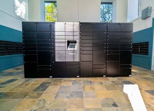 A black LUXEO refrigerator with a digital display on the front.