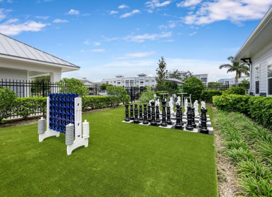 a large outdoor chess set on the lawn