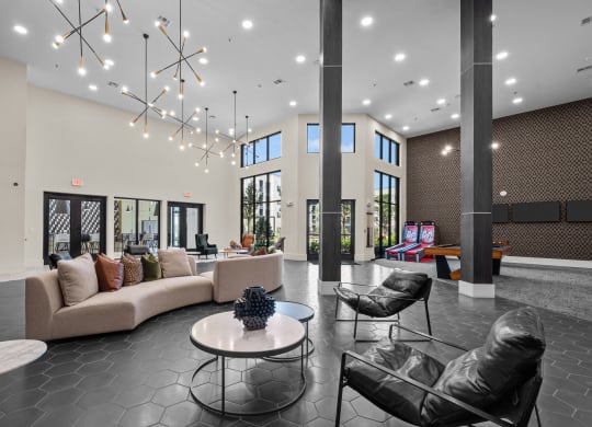 a large lobby with couches and chairs and a table