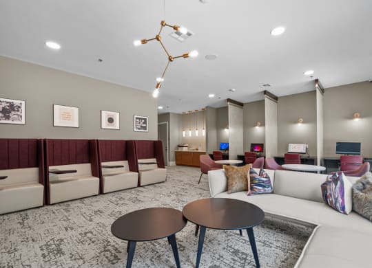 a living room with couches and chairs and tables