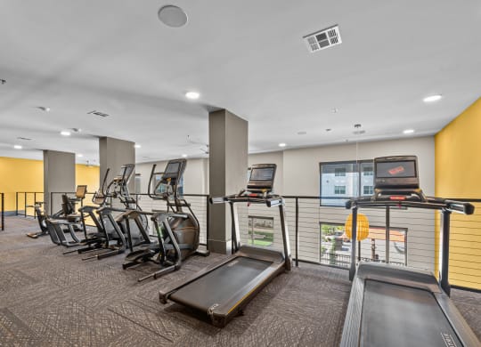 the gym has cardio equipment and treadmills at the flats at west end apartments