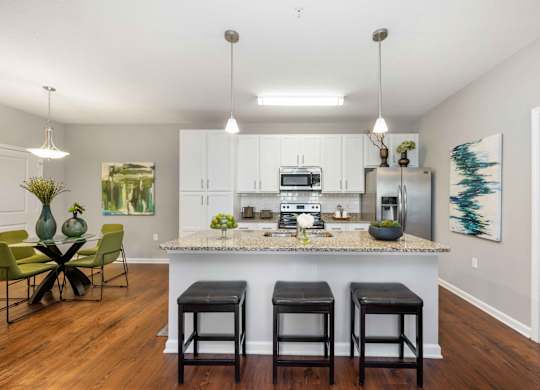 a kitchen and dining area in a 555 waverly unit
