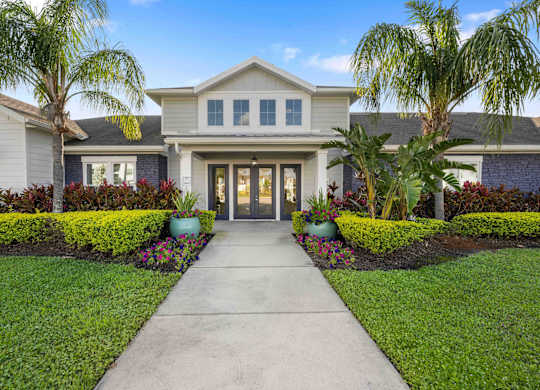 a large house with a sidewalk in front of it