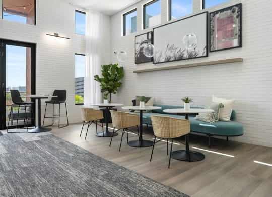 a living room with tables and chairs and a couch