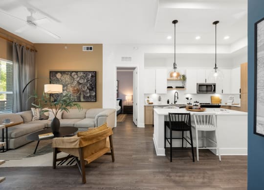 a living room with a kitchen and a dining room