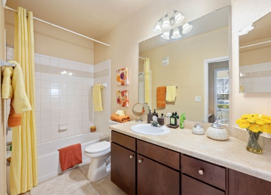 Ensuite bahtroom with wooden cabinetry