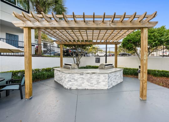 a patio with a seating area and a pergola