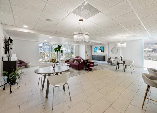 A white room with a table and chairs.