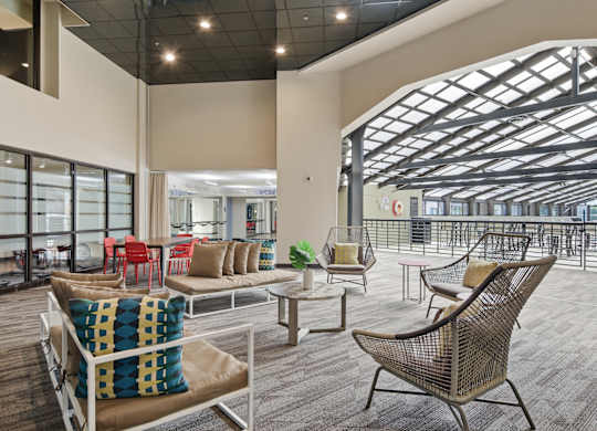 A large room with a lot of chairs and tables.