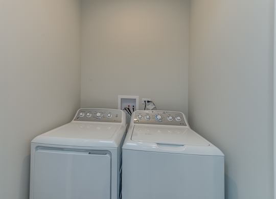 A laundry room with LG washer and dryer appliances.