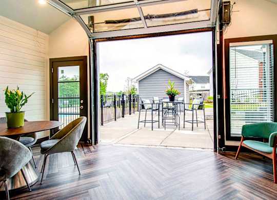 A patio with a table and chairs is shown.