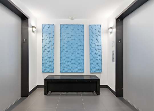 An elevator lobby with two elevators.