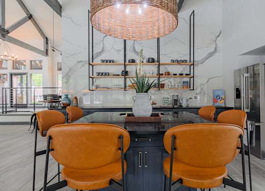 a dining area with a table and chairs and a large window