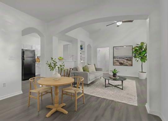 A modern living room with a wooden table and chairs.