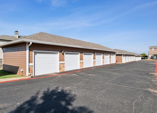 A long row of garage doors are closed.