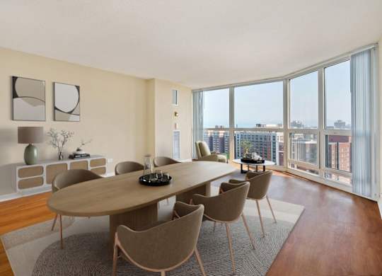 A modern dining room with a large table and chairs.