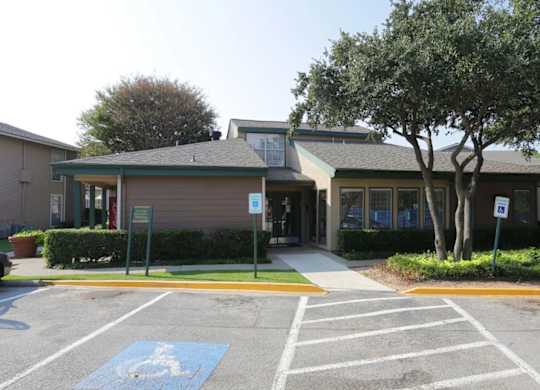 a building with a parking lot in front of it