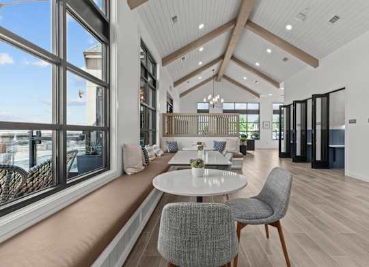 A modern dining area with a table set for two.