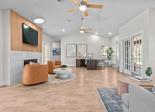 A living room with a television, a fireplace, and a ceiling fan.