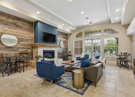 A living room with a fireplace and a television.