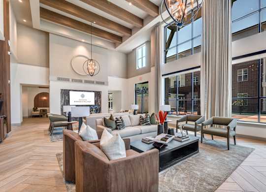A modern living room with a large window and a fireplace.