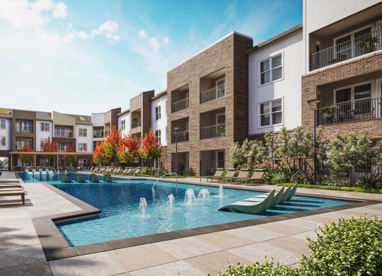 an outdoor pool with lounge chairs in front of an apartment building