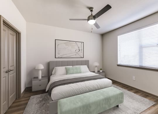 a bedroom with a bed and a ceiling fan