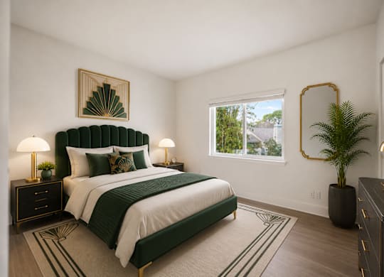 A bedroom with a large bed and a green headboard.
