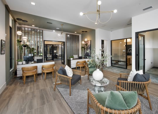 a living room with a table and chairs