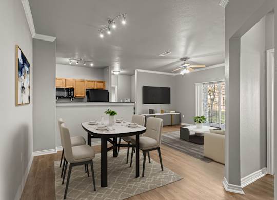 A dining room with a table set for four.