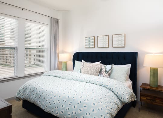 a bedroom with a bed and a ceiling fan