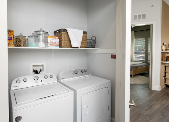 the washer and dryer in the laundry room of a home