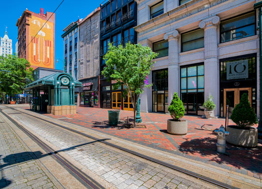 a city street with a train track in the middle of it