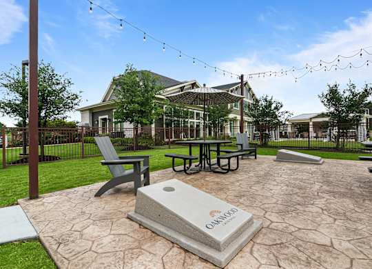 A stone monument with the word Omaha on it sits in the middle of a courtyard.
