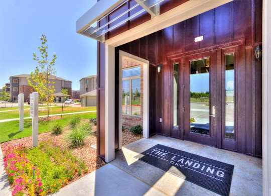 The entrance to a building with a sign that says
