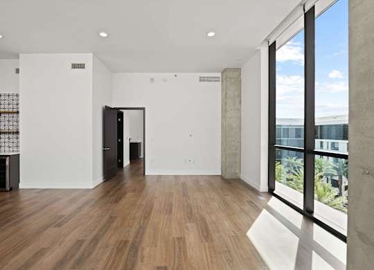 A room with wooden floors and white walls.
