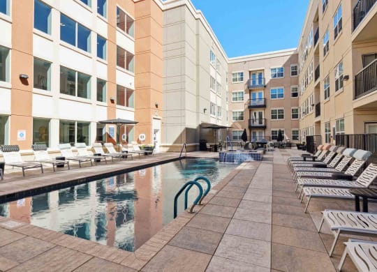 a swimming pool in the middle of some buildings